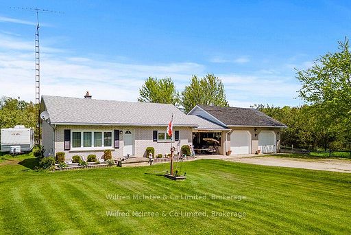 a house with a lawn and a flag