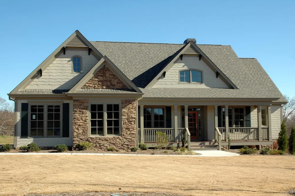 A bright red For Sale sign stands in front of a house, symbolizing real estate transactions and timing challenges.